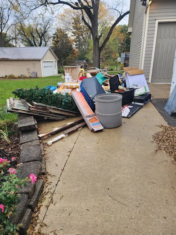 Dumpster being loaded with debris for Roofing Dumpster Rental in West Haven-Sylvan